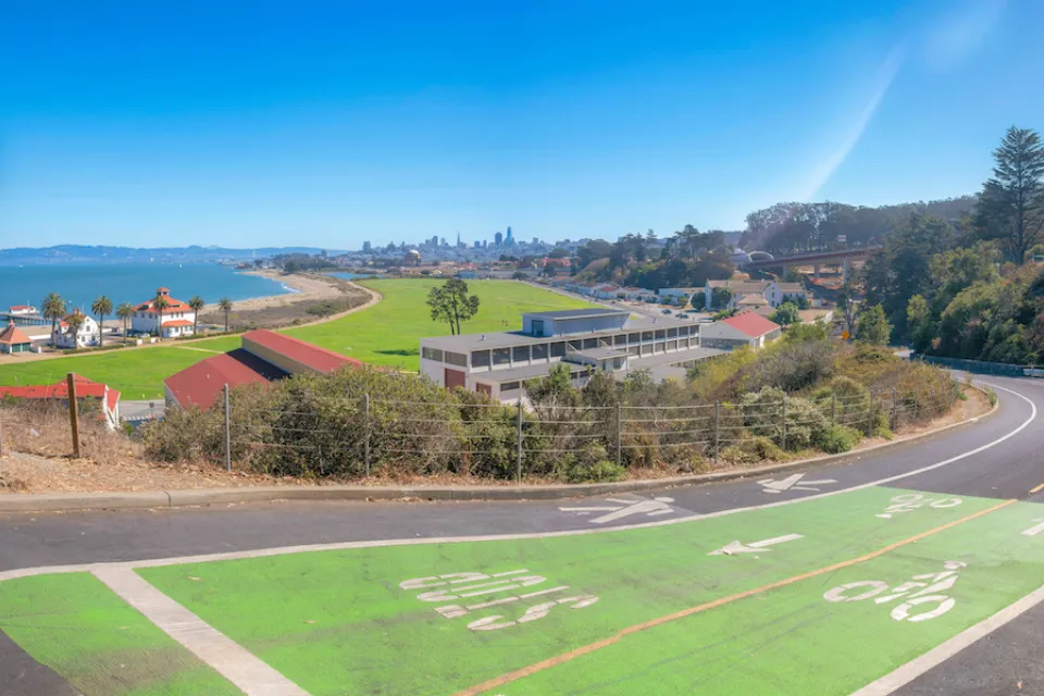 Green painted bike and pedestrian trail with view of San Francisco Bay.